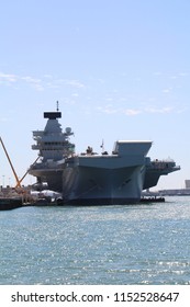 Portsmouth, UK - 5 August, 2018: The Aircraft Carrier Queen Elizabeth At Anchor In Its Home Port. This Is The Largest Warship In The Royal Navy Fleet. 
