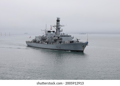 PORTSMOUTH, UK – 7TH JUN 2021: The Royal Navy Frigate HMS NORTHUMBERLAND Arriving At The Naval Base With The Offshore Patrol Vessel HMS SPEY At Anchor In The Solent