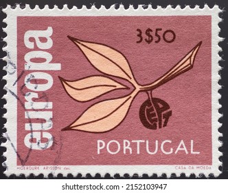 PORTUGAL - CIRCA 1965: a postage stamp from PORTUGAL, showing a branch with leaves and a fruit with the letters CEPT formed. Text : EUROPE. Circa 1965
