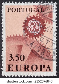 PORTUGAL - CIRCA 1967: a postage stamp from PORTUGAL , showing a gears meshing with the emblem of the CEPT. Text : EUROPE. Circa 1967