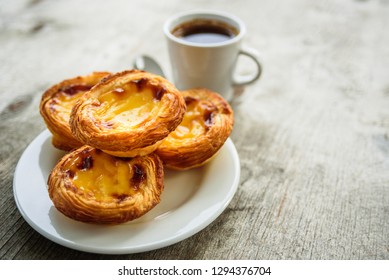Portugal Egg tarts Pastel de Nata serving on plate with coffee - Shutterstock ID 1294376704