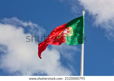 Portugal flag isolated on sky background. close up waving flag of Portugal. flag symbols of Portugal.