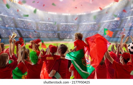 Portugal football supporter on stadium. Portuguese fans on soccer pitch watching team play. Group of supporters with flag and national jersey cheering for Portugal. Championship game.  - Shutterstock ID 2177950425