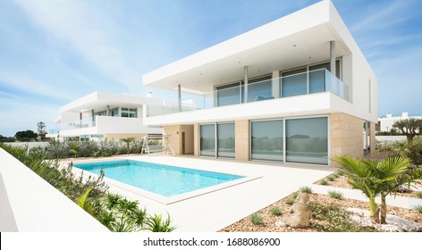 Portugal, Lagos, 05 April 2018 - illustrative editorial. White villa, cottage, luxury house for recreation with swimming pool, terrace with a view, balcony, modern design.