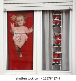 Portugal /Lisbon – December 6, 2011: At Christmas It Is Easy To See Humble Windows Decorated With Christmas Symbols Such As Santa Claus And Baby Jesus.