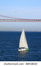 Portugal Lisbon Leisure Yacht sailing toward the 25th April Bridge on the Tagus River - "Tejo" river