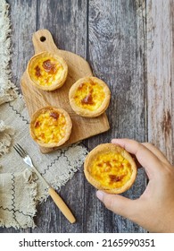 Portugese Egg Tart With A Wooden Background