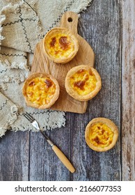 Portugese Egg Tart With A Wooden Background