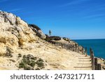 Portuguese coast in Benagil, Algarve, Portugal. Farol de Alfanzina. Alfanzina Lighthouse. Percurso dos Sete Vales Suspensos. Seven Hangging Valleys Trail.