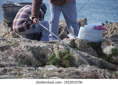 Portuguese fishermen prepare tackle, caught fish - Shutterstock ID 1913913730