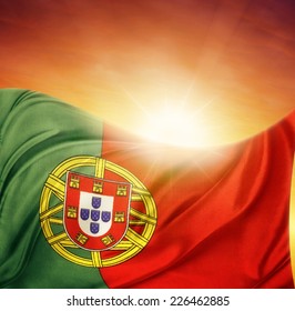Portuguese flag in front of bright sky
