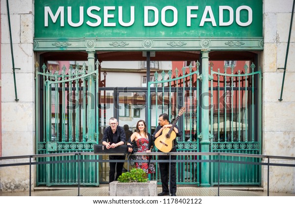 Portuguese guitar player,\
fado singer and acoustic guitar player in front of Fado Museum in\
Lisbon, Portugal