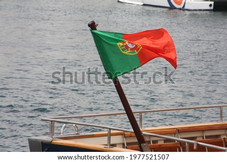 Similar – Image, Stock Photo Portuguese flag on boat in front of old town of Porto / Portugal