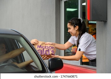 POSADAS, ARGENTINA; OCTOBER 30, 2019:  young employees in a McDonalds restaurant in south america