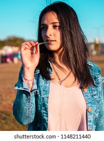 Posadas,Misiones/Argentina 1/08/2018
Teenage Woman Taking Fashion Photos Outdoors On A Sunset, Her Dress Style Is Urban And A Bit Formal