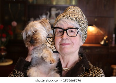 Posh Senior Woman With Vintage Leopard Print Look Matching Her Dog
