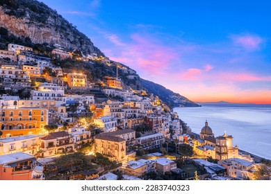 Positano, Italy along the Amalfi Coast at dusk. - Powered by Shutterstock