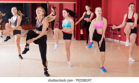 Positive Active Females Funk Jazz Dancers Exercising Dance Moves In Studio