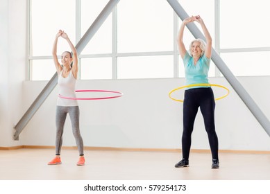 Positive Active Women Rotating Hula Hoops