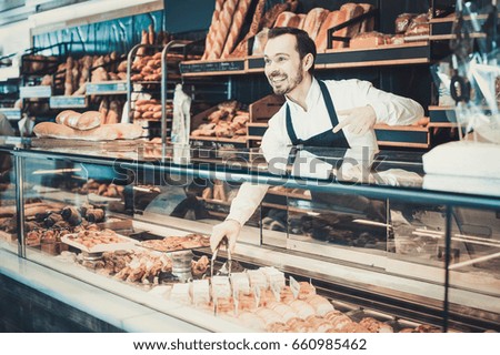 Similar – Image, Stock Photo African man works in pastry shop.