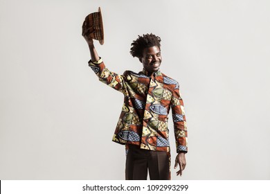 Positive Africam Model Holding Hat Say Hello,hi! Indoor, Isolated On Gray Background