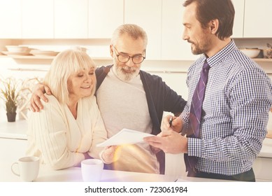 Positive Aged Couple Talkign With Real Estate Agent