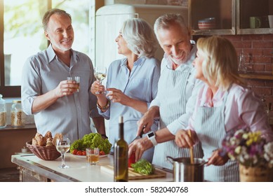 Positive Aged Friends Cooking Together