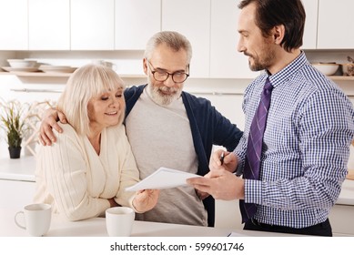 Positive Aging Couple Owners Meeting Financial Adviser At Home