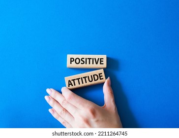 Positive Attitude Symbol. Concept Words Positive Attitude On Wooden Blocks. Beautiful Blue Background. Businessman Hand. Business And Positive Attitude Concept. Copy Space.