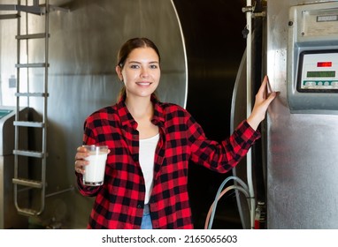 Positive Attractive Woman Dairy Farm Worker Standing With Glass Of Fresh Milk