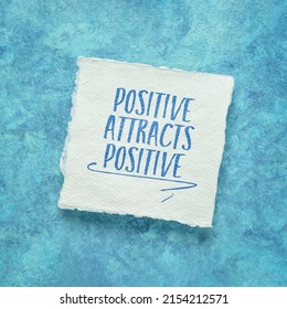 positive attracts positive - law of attraction concept - inspirational note on a handmade paper - Shutterstock ID 2154212571