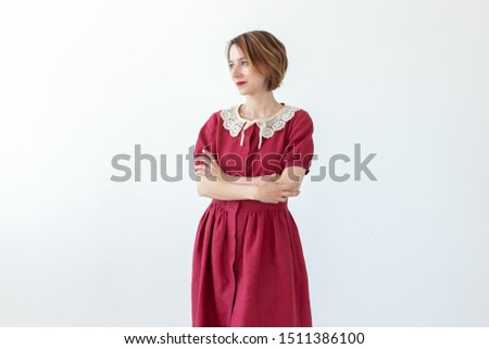 Similar – young beautiful lady posing in the living room next to a window