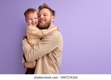 positive caucasian father and son hugging, shine with happiness - Powered by Shutterstock