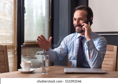 Positive Confident Man Having A Conversation On The Phone