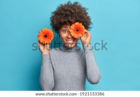 Similar – Image, Stock Photo An isolated blue flower in the green grass