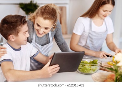 Positive Delighted Family Having Fun In The Kitchen