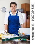 Positive designer-constructor with tools and documentation at work place