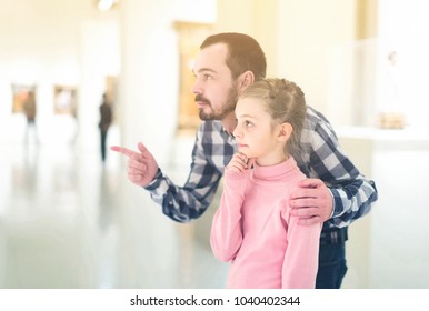 Positive European Father Daughter Looking Paintings Stock Photo