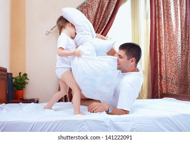 Positive Father And Son Having Fun At Home, Pillow Fight