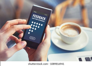 Positive Feedback, Customer Satisfaction Concept, Woman Rating Service Online And Writing Review On Smartphone