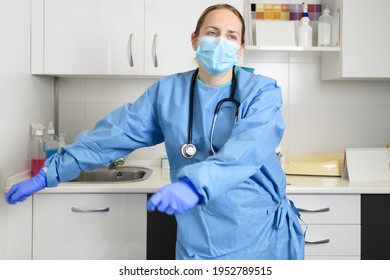 Positive Female Doctor Dancing Floss Dance In Hospital, Celebrating The End Of Coronavirus Pandemic. High Quality Photo.