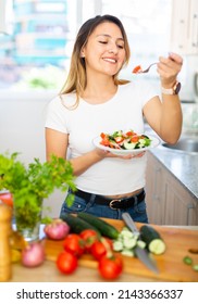 Positive Female Eating Healthy Salad With Fresh Vegetable