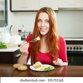 Positive Girl Eating Jacket Potatoes At Home Interior