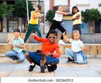 Positive Girls And Boys Training Hip Hop On City Street, Outdoor Dance Class For Kids