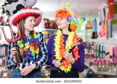 Positive Girls Shopping Together, Looking For Funny Things In Store Of Festival Outfits And Accessories