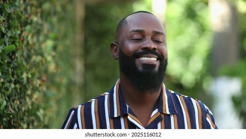 Positive Happy African Man Smiling Outside Breathing Fresh Air.