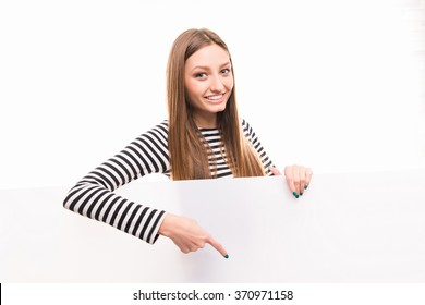 Positive Happy Girl Pointing Down To The Empty Space