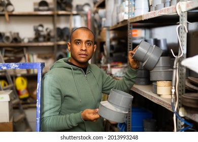 Positive Hispanic Man Looking For Construction Supplies For Renovation Works In Building Hypermarket