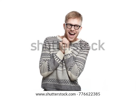 Positive human emotions, feelings, reaction and attitude. Picture of funny ecstatic male student in glasses, holding clenched fists on his chest and smiling broadly, excited with results of exams