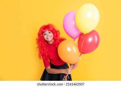 Positive Kid With Party Balloon On Yellow Background